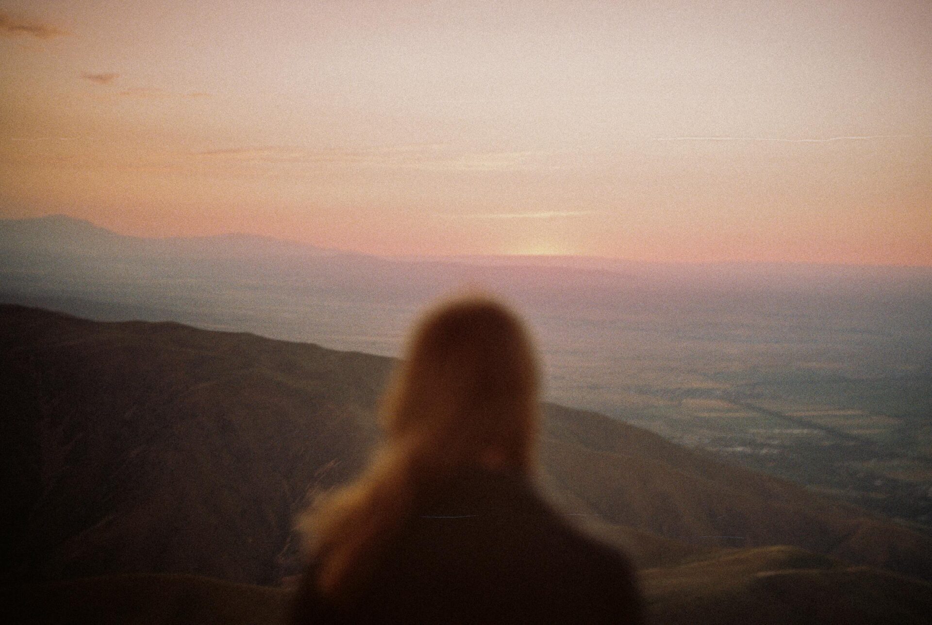 Woman in a Mountains Having view on the Sunrise